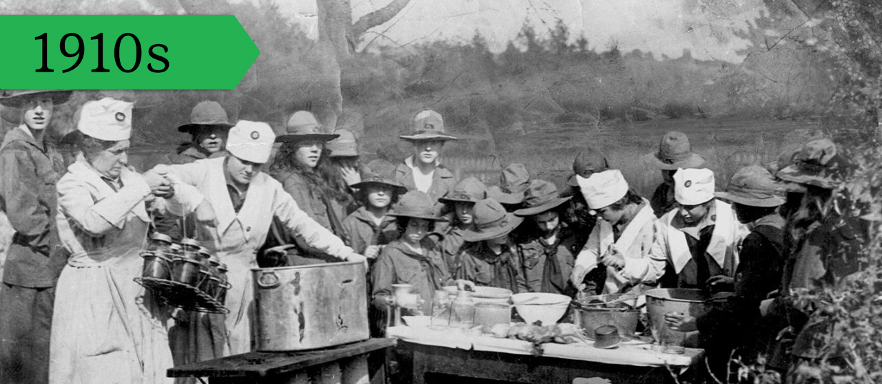 Girl Scouts team up to preserve fruits and vegetables in response to food shortages, circa 1917. 