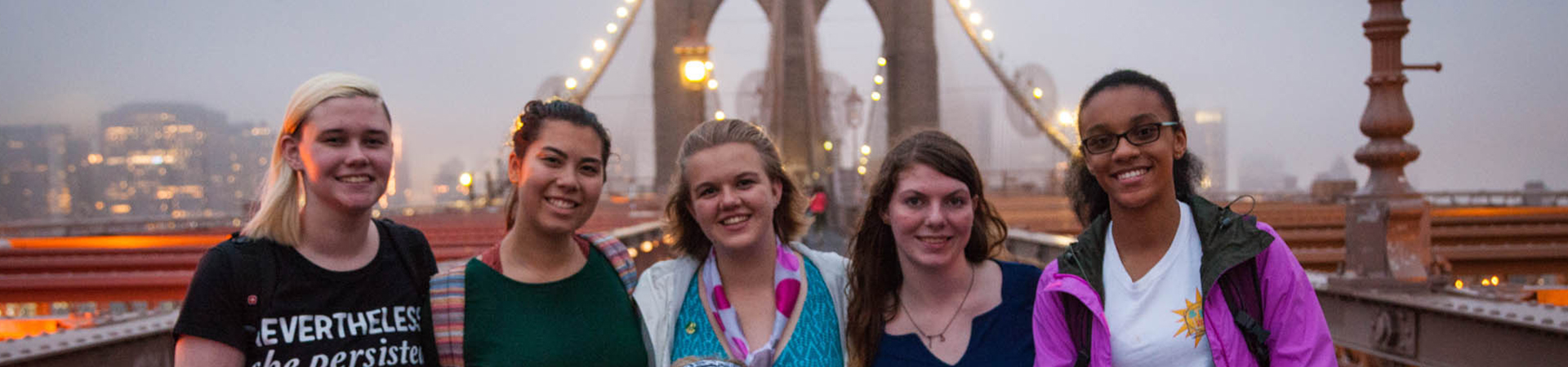  Five Girl Scouts posing for a picture in front of the Brooklynn Bridge 