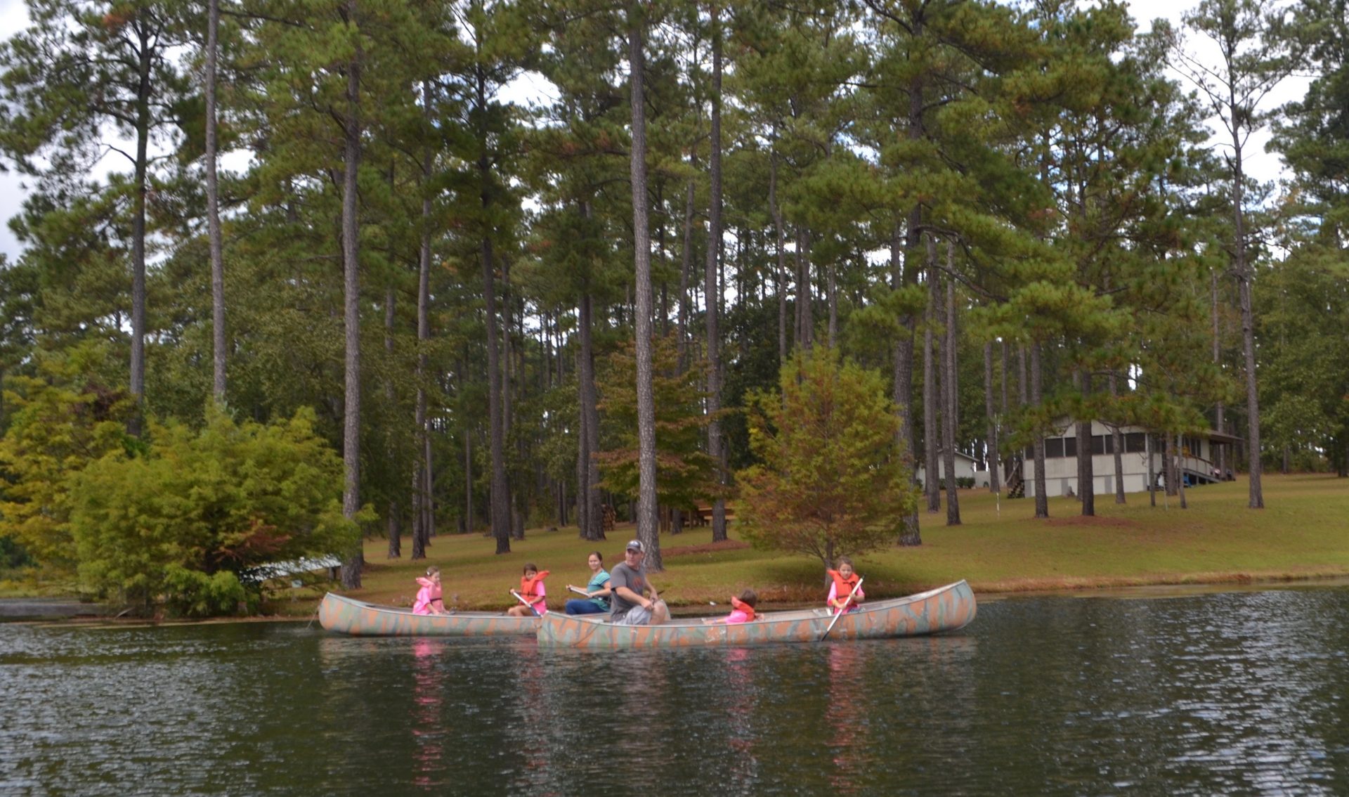 The girls of Daisy Troop #4890 enjoy a scenic canoe ride with Troop Leader Karl.