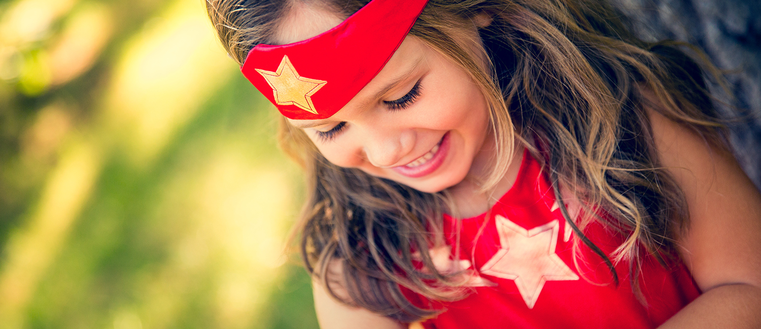  Little girl daughter dressed up as a Wonder Woman superhero. 