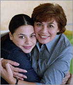 Photo of a mother and daughter hugging.
