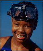 Photo of a girl with swim goggles. © GSUSA. All rights reserved.