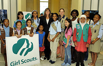 Photo of Juliette Gordon Low posing with some of the nation's first Girl Scouts. &copy; GSUSA. All rights reserved.