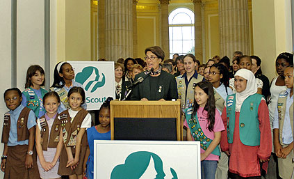 Photo of Juliette Gordon Low posing with some of the nation's first Girl Scouts. &copy; GSUSA. All rights reserved.