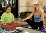 Photo of Girl Scout with yoga instructor.