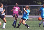 Photo of Girl Scouts playing soccer.