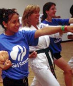 Photo of Girl Scouts participating in self-defense class. &copy; GSUSA. All rights reserved.
