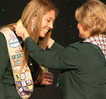 Photo of Analucia being honored by Girl Scout CEO Kathy Cloninger