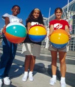 Photo of Girl Scouts holding beach balls. &copy; GSUSA. All rights reserved. (Photographer: Lori Adamski-Peek)