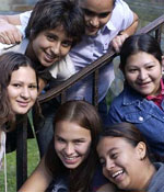 Photo of Girl Scouts sitting on steps outdoors. © GSUSA. All rights reserved.