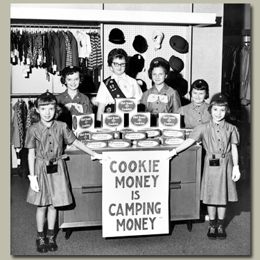 Photo of 1960s cookie sale. &copy; GSUSA. All rights reserved.