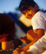 Photo of a Girl Scout sitting outdoors. &copy; GSUSA. All rights reserved. (Photographer: Lori Adamski-Peek)