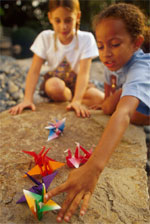 Photo of Girl Scouts making origami. &copy; GSUSA. All rights reserved. (Photographer: Lori Adamski-Peek)