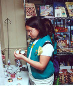 Photo of a Junior Girl Scout visiting the Birthplace shop. &copy; GSUSA. All rights reserved.