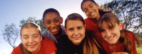 Photo of Girl Scouts laying on the grass. &copy; GSUSA. All rights reserved. (Photographer: Lori Adamski-Peek)