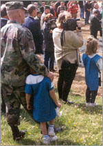 Photo of Army dad with Daisy Girl Scout.