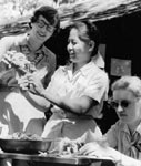Photo of two women taking part in arts and crafts activities, circa 1949-1958. &copy; GSUSA. All rights reserved.