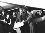 Photo of a Wing Scout conferring with William T. Piper. © GSUSA. All rights reserved.