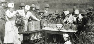Photo of Girl Scouts preserving fruits and vegetables. © GSUSA. All rights reserved.
