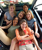 Photo of girls in car trunk.