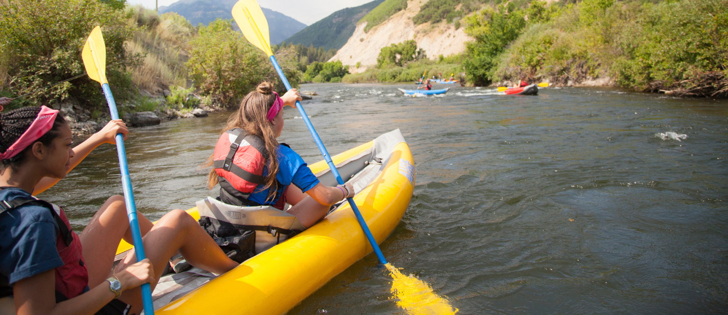 girls rafting in the mountains