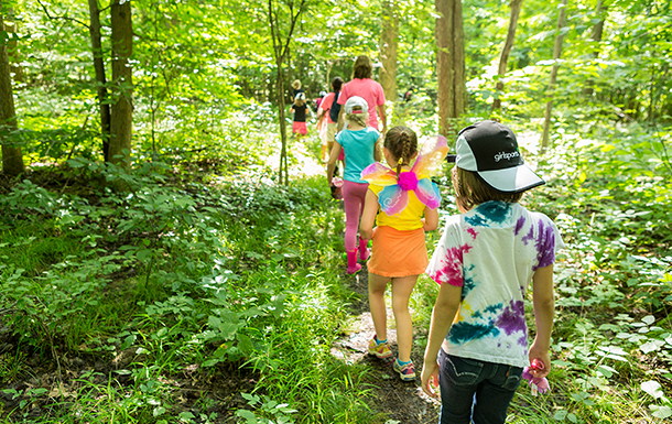 Girl Scout Troop Hiking in the woods