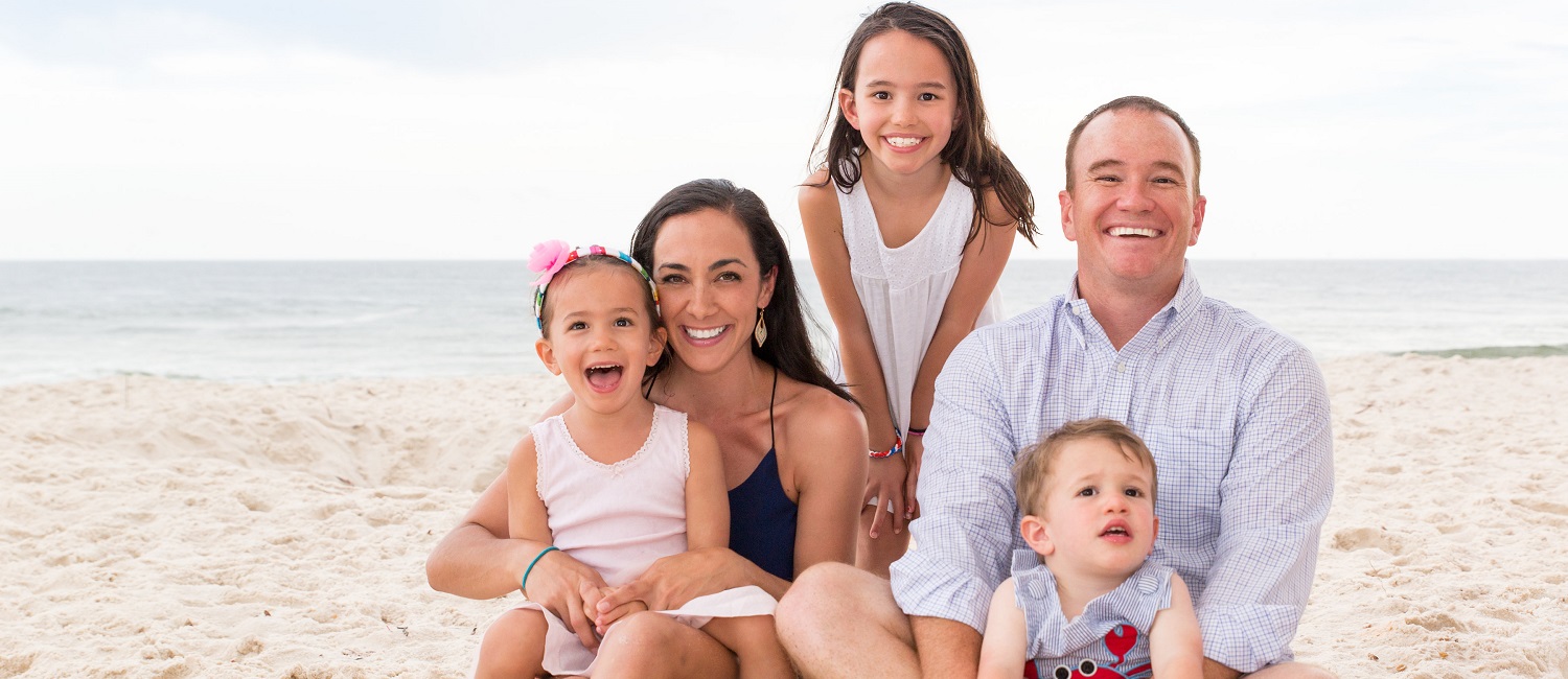  Nicole Hughes and her family at the beach.  