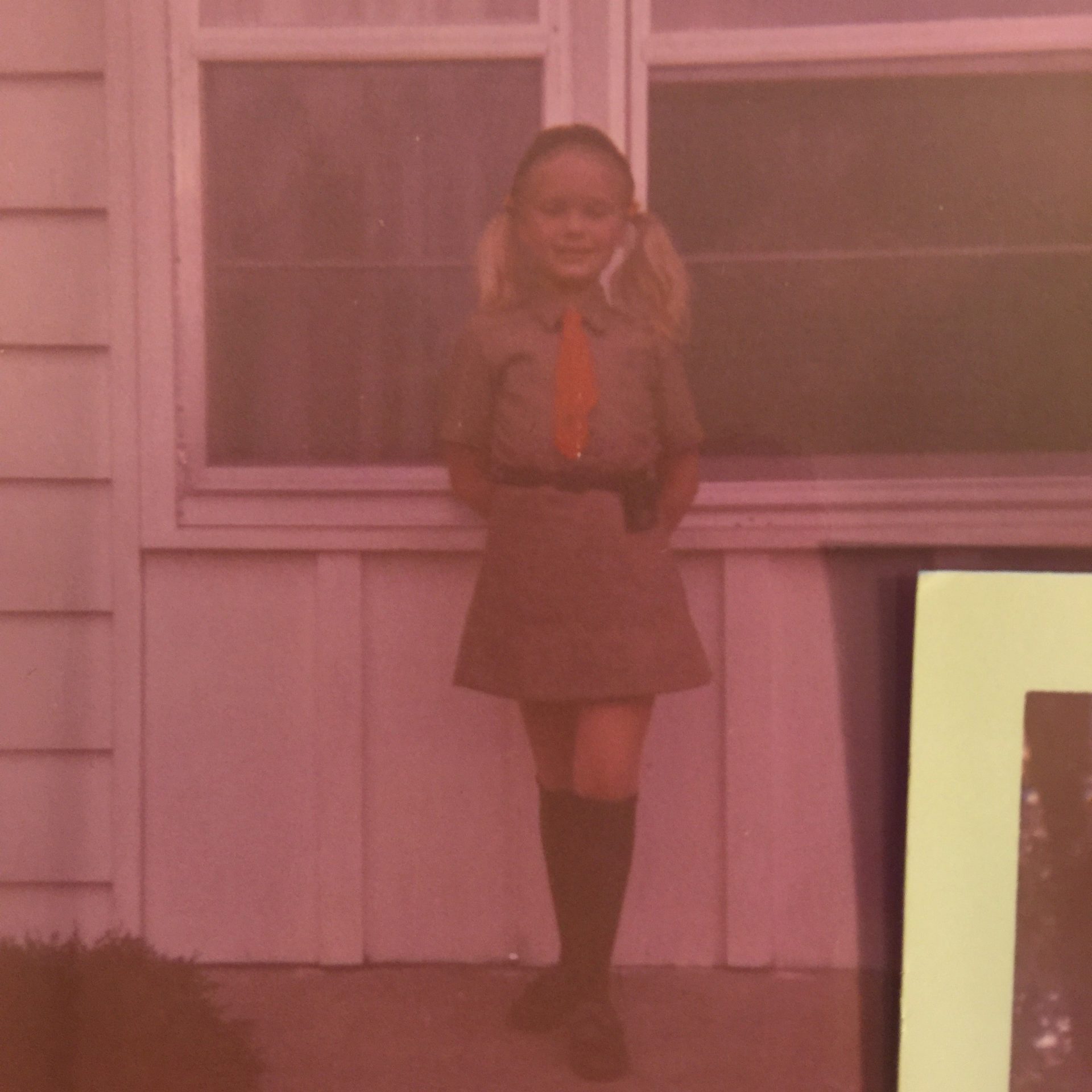 Lori gets ready to head off to her Girl Scout Brownie investiture ceremony in 1970.