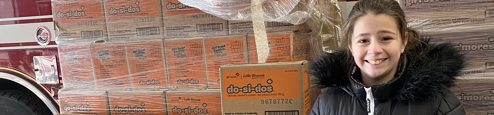  Heather in front of a pallet of Do-Si-Dos 