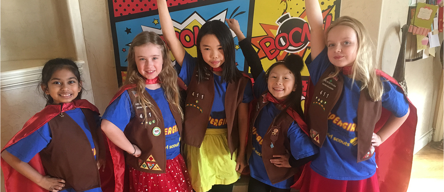  The Supergirls, a team of young Girl Scout robotics rock stars, stand proud and tall. 