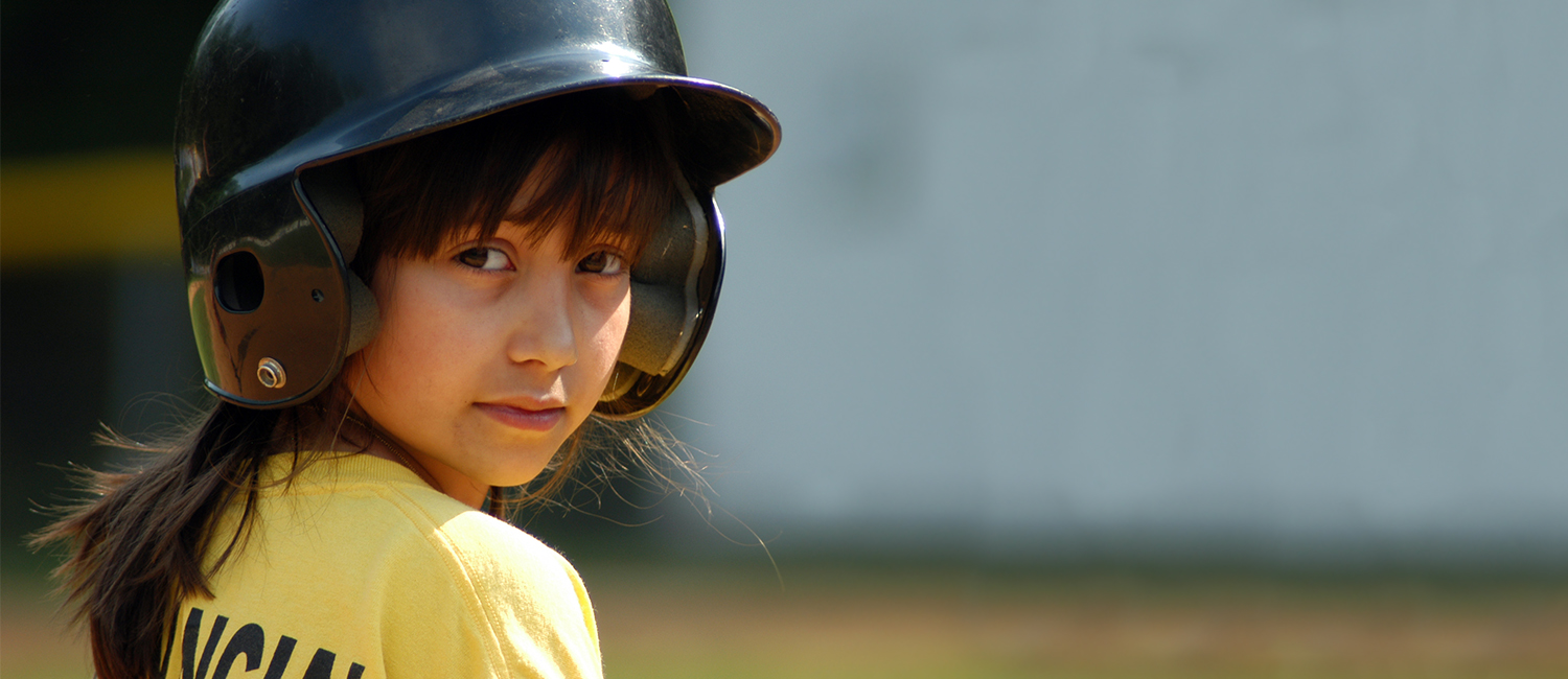  Sporty girl playing softball. 