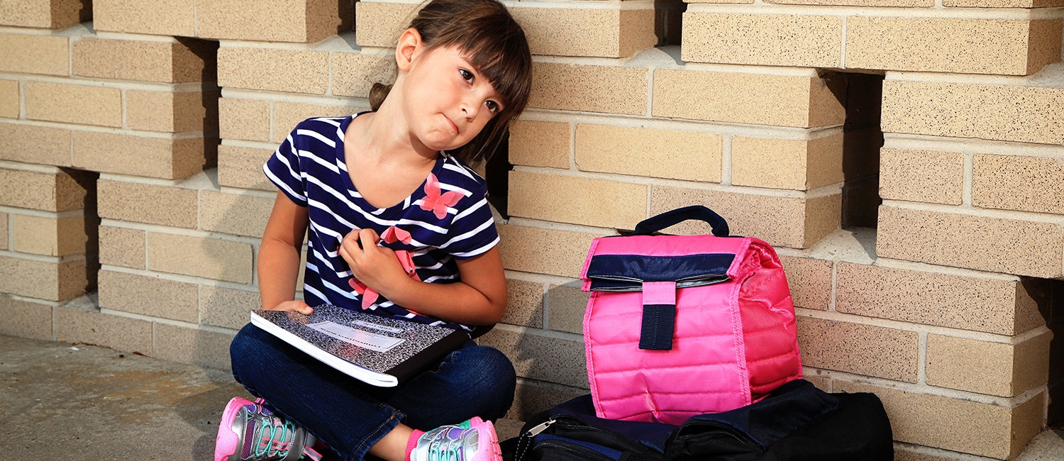  Little girl feels nervous about starting kindergarten. 