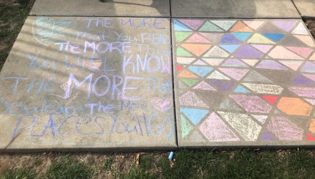  A sidewalk completely decorated with chalk 
